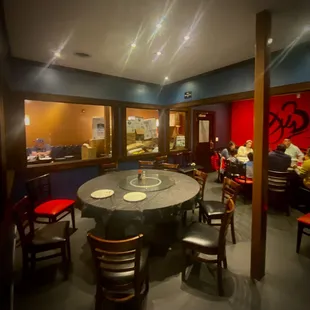 a dining room with a table and chairs