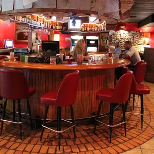 a man and a woman sitting at the bar