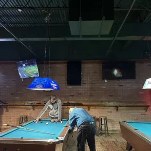 two men playing pool