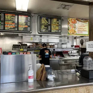 a restaurant counter with menus