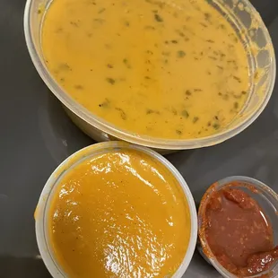two bowls of soup and a bowl of ketchup