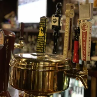 a golden beer tap