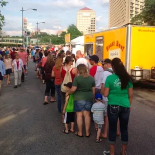 a large group of people standing in line