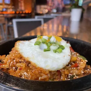 a fried egg on top of rice