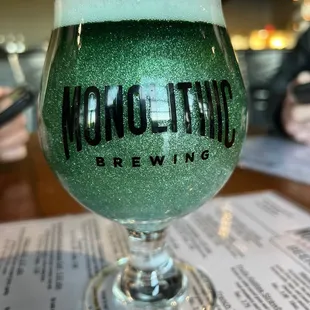 a glass of beer on a table