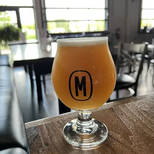 a glass of beer on a table