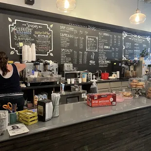 a woman working behind the counter