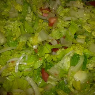 a salad with lettuce and tomatoes