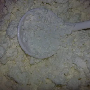 a spoon in a pile of flour