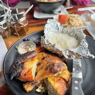 The Monora Grilled Chicken house special comes with sticky rice and a free papaya salad too. That spicy sauce is amazing