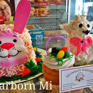two decorated cupcakes in the shape of bunnies