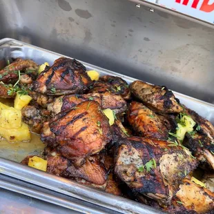 chicken and pineapples in a pan