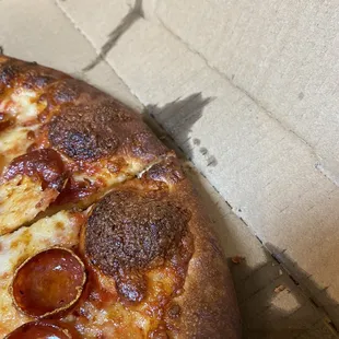 a pepperoni pizza in a box