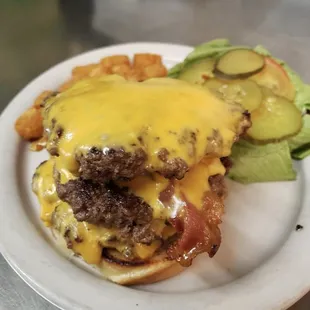 cheeseburger with pickles and avocado