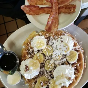 a plate of waffles and bacon