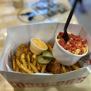 Chicken tenders and fries and Mac and cheese with Hot Cheetos