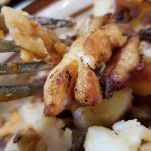 Honestly I don't know what this was. Looked &amp; tasted like chicken? It was not potatoes as you can see underneath.