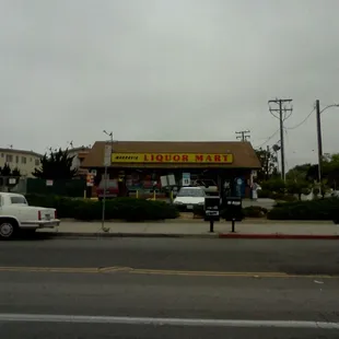 a white car parked in front of it