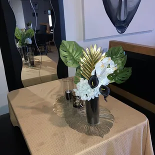 a vase of flowers on a table