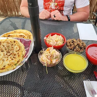 a man sitting at a table with food