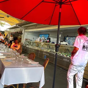 a woman standing under an umbrella