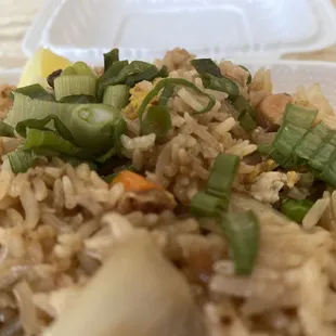 a plate of rice with vegetables