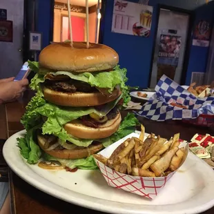 a giant hamburger with a side of fries
