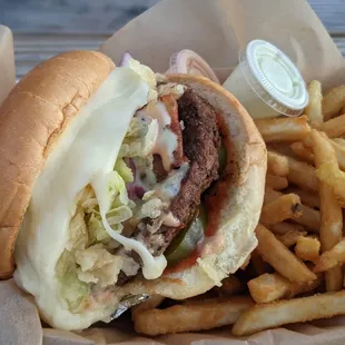 a close up of a burger and fries