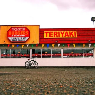 a bike parked in front of a restaurant