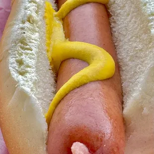 a hot dog with mustard and ketchup