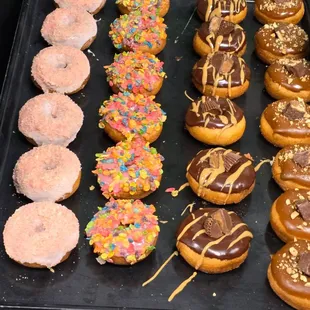 Strawberry shorcake donur Fruitty Pebbles donut , snickers donut, Resses donut