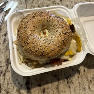 Bacon egg and cheese bagel with hashbrown inside