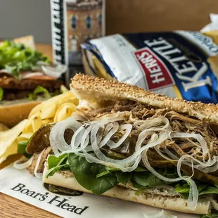 a pulled pork sandwich and chips