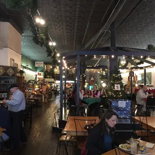 people sitting at tables in a restaurant