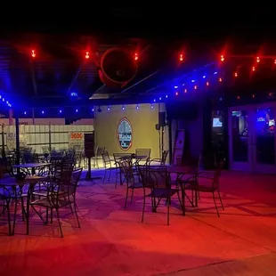tables and chairs lit up with red and blue lights