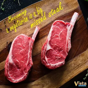 two raw steaks on a cutting board