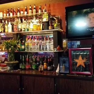 a woman standing at the bar