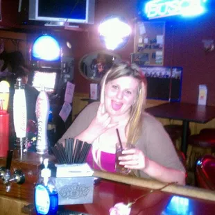a woman sitting at a bar