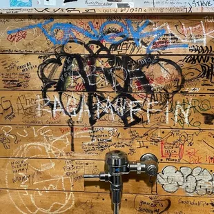 Graffiti wall in the mens restroom