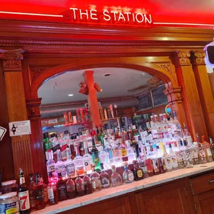 a bar with a neon sign
