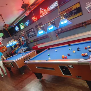 pool tables and neon signs