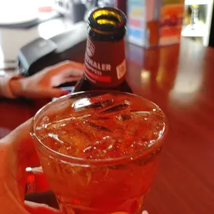 a person holding a drink