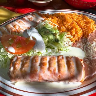 Chicken Chimichangas with rice, beans, lettuce, tomato, and sour cream. It was delicious.