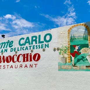 a mural on the side of a restaurant