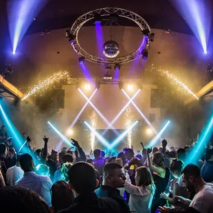 a crowd of people dancing at a party