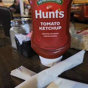 a bottle of hunt's tomato ketchup