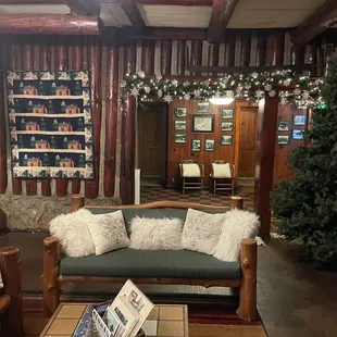 a living room with a christmas tree