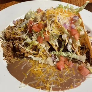 Taco Tuesday:  Ground Beef Tacos (3); rice and beans.  Not hot, mediocre. Like budget store tacos made with boxed shells.