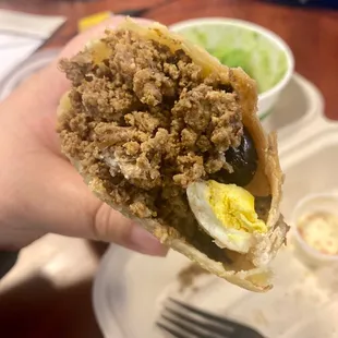 Inside of beef empanada: ground beef, eggs and olives. Yummm!