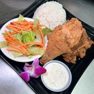 This is fried chicken with white rice and salad.